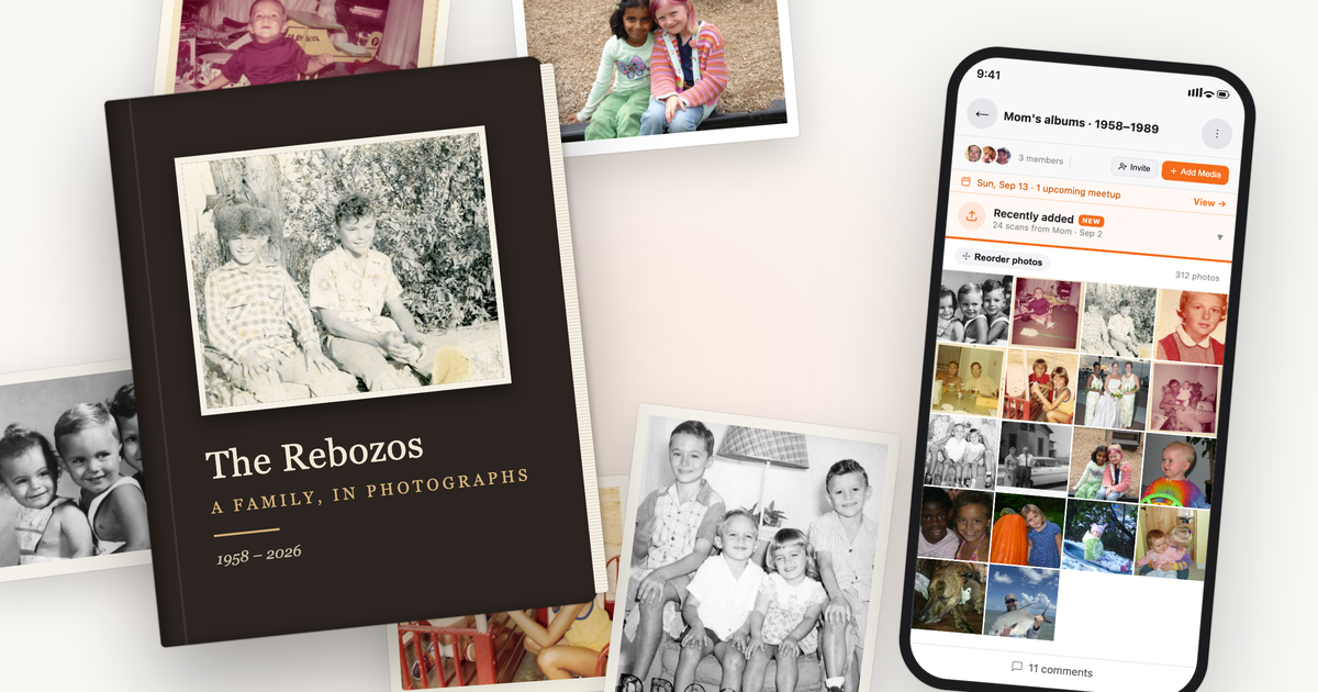 A hardcover family photo book resting on loose vintage prints, beside a phone showing the same scanned photos organized in a Memrico album.