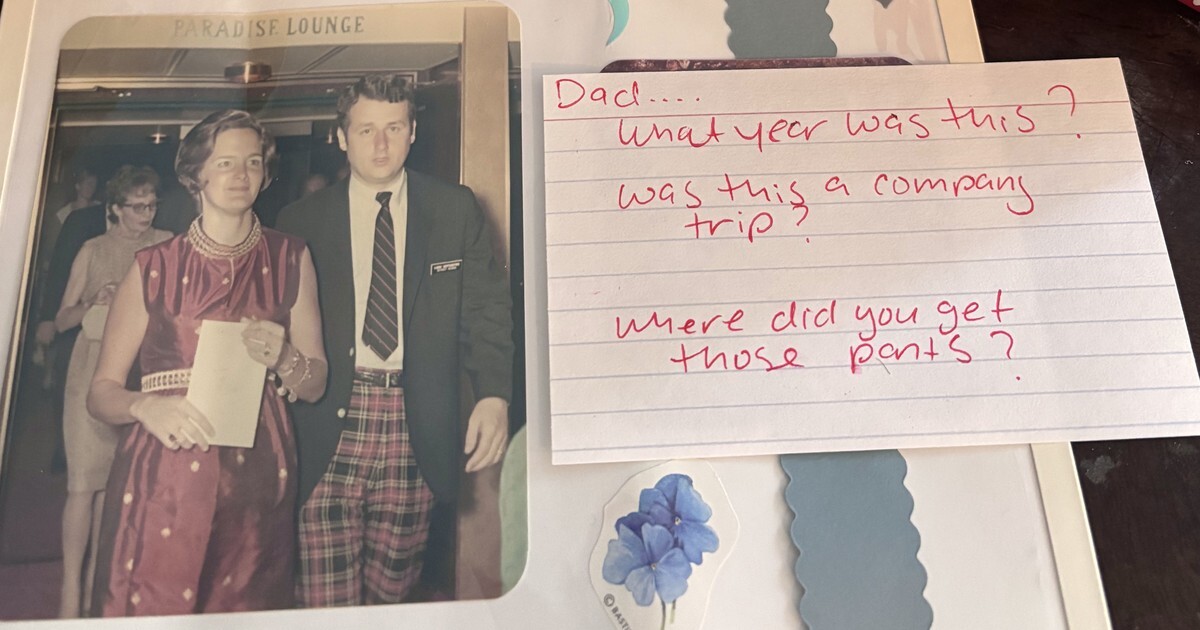 A vintage photo of a couple at the Paradise Lounge in an album, next to a handwritten index card asking: Dad, what year was this? Was this a company trip? Where did you get those pants?